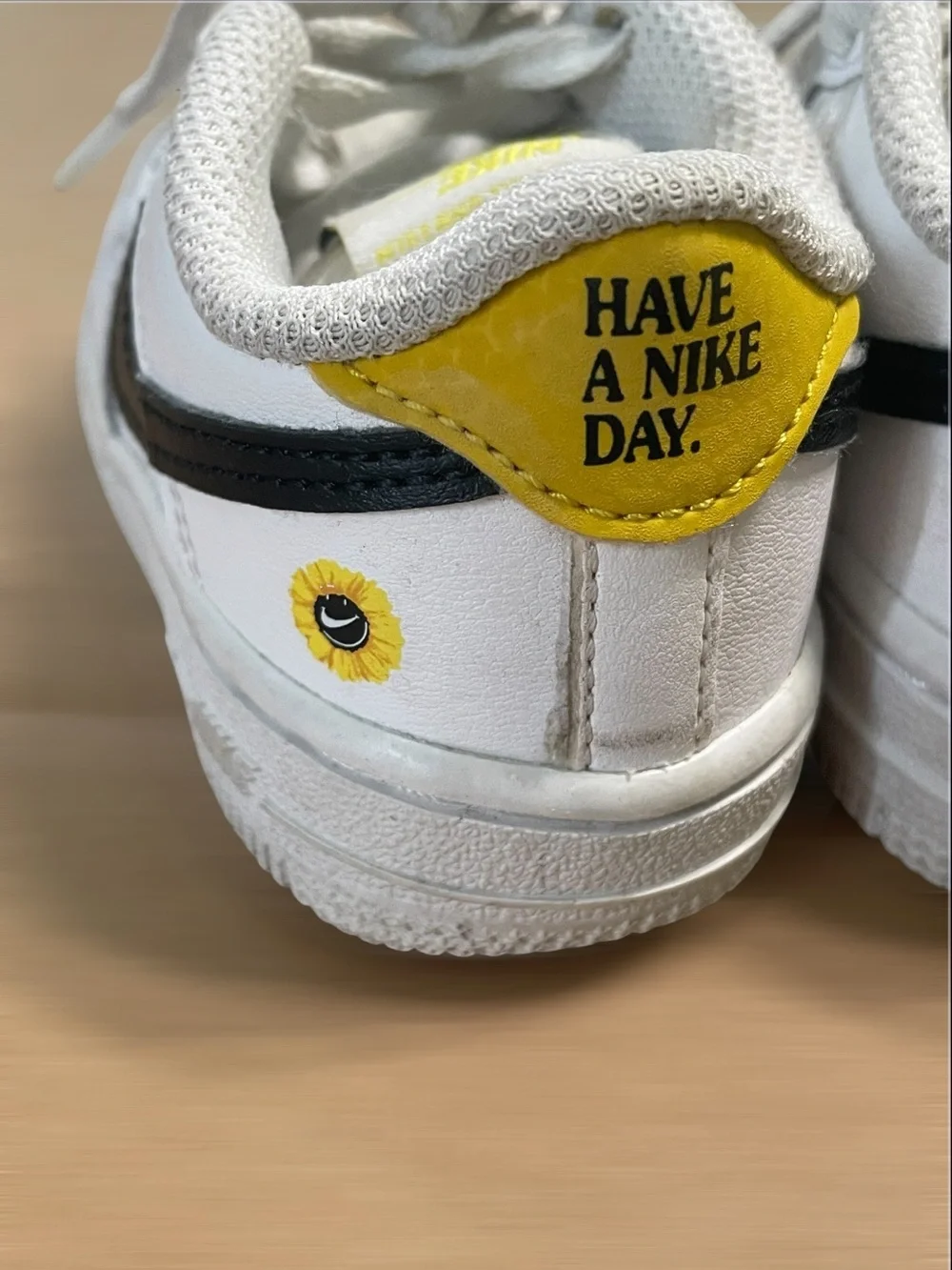 Nike Toddler White Sneakers with Black Swoosh and Yellow Star